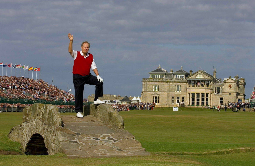 Jack Nicklaus waves on the Swilcan Bridge at St Andrews